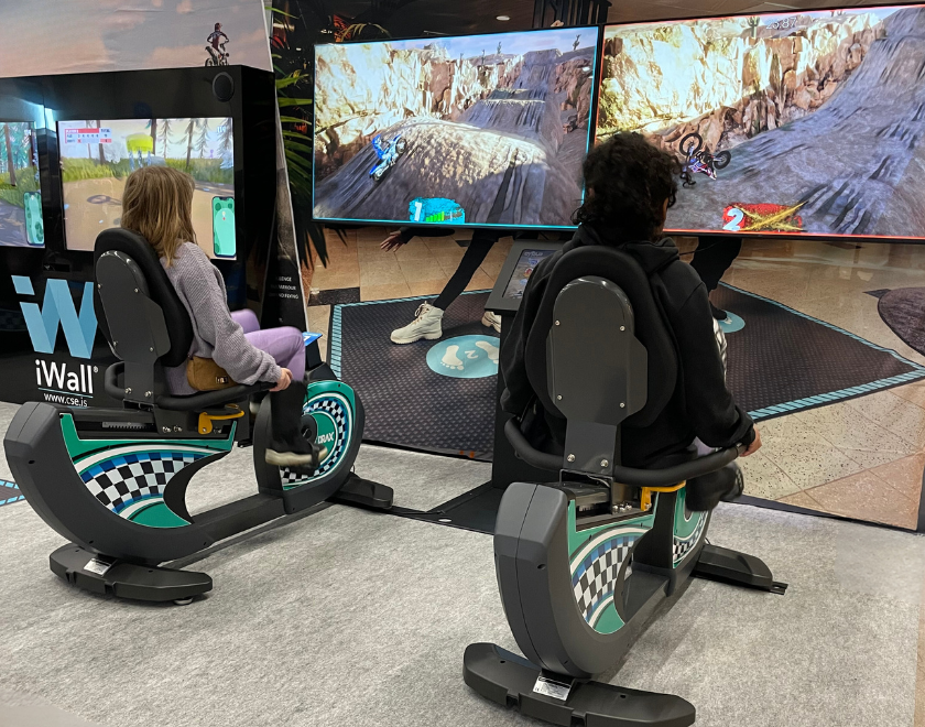Kids and teens playing on cycloBEAT - indoor cycling activity.